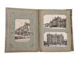 an old photo of a book with pictures of buildings on it