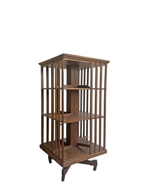 Bibliothèque tournante en bois naturel de section carrée à trois nivea