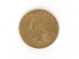 a gold coin with an indian head on it on a white surface