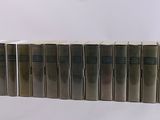 six books are stacked on top of each other on a white surface