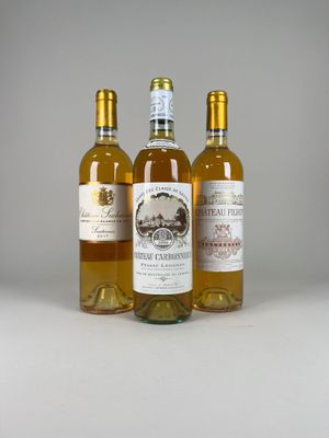 three bottles of wine sitting next to each other on a table