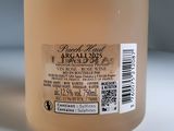 a bottle of liquid sitting on a table with a label on it