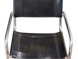 a black leather chair with chrome legs and a black leather seat