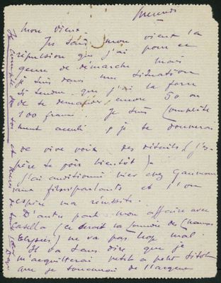a letter written in purple ink on a piece of paper