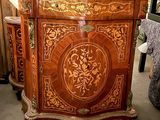 a wooden cabinet with a floral design on it