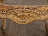 a close up view of a chair with a wooden seat