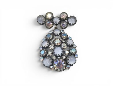 a close up of a brooch on a white background