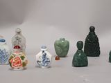 many small vases that are sitting on a table