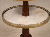 a three tiered table with a marble top and a wooden base