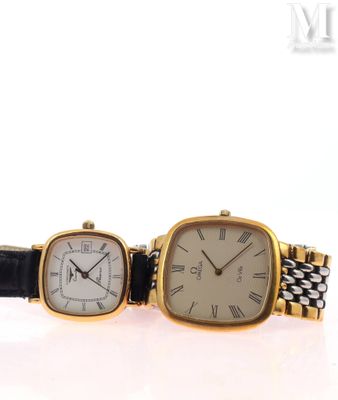an image of a couple of watches sitting next to each other