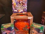 a box of cards and a box of games on a table