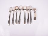 six forks and spoons are arranged in a row on a white surface