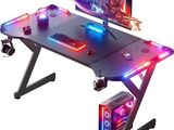 a close up of a gaming desk with a monitor and keyboard
