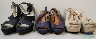 four pairs of women ' s shoes are lined up in a row