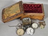 many different types of pocket watches in this box