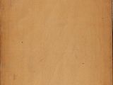 an old piece of paper that is sitting on a table