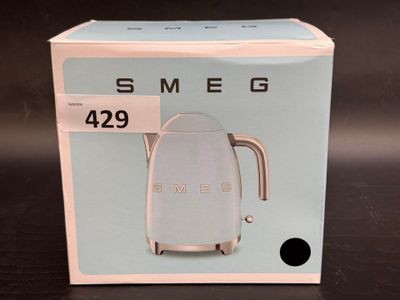 a box with a tea kettle on it on a table