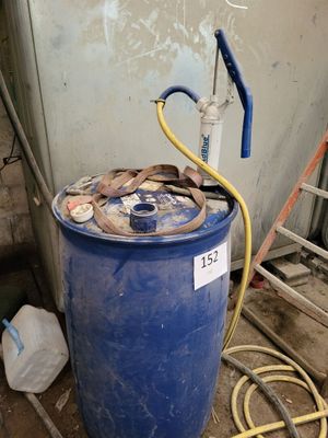 a blue barrel with a hose and a hose attached to it