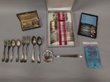 a box of silverware and silverware on a table