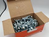 a box full of screws sitting on a table