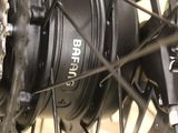 a close up of a bicycle wheel with a chain attached to it