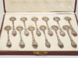 a lot of spoons in a case on the table