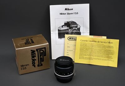 Objectif Nikkor 28mm f/ 3.5 dans sa boite, facture et notice…