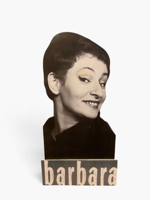 black and white photograph of a woman ' s face with the word barbara on it