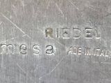 a close up of a metal plate with a name engraved on it