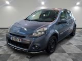 a picture of a small blue car parked in a garage
