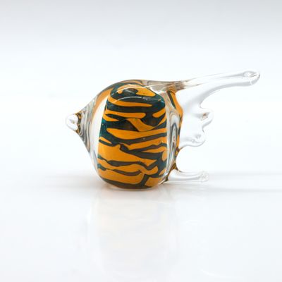 a glass vase that has a tiger print design on it