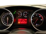 a close up of a car dashboard with various gauges