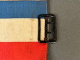 a close up of a wallet with a buckle on a table