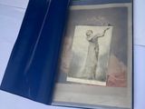 a blue book with a picture of a woman on it