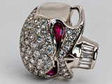 an image of a diamond and ruby ring on a white background