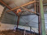 a crane that is hanging from the ceiling of a building