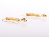 pair of yellow gold earrings with pink sapphires and diamonds