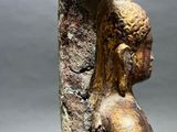 statue of a woman holding a bird on her head