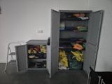 a cabinet with a lot of clothes in it