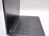 a laptop computer sitting on top of a white table