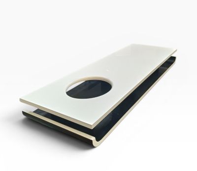 a white and black book with a hole in it