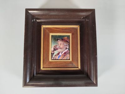 tableau représentant un homme coiffé d'un chapeau et portant une moustache, dans un cadre marron