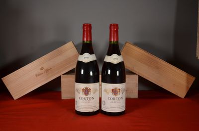 two bottles of wine sitting next to each other on a table