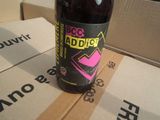a bottle of soda sitting on top of a cardboard box