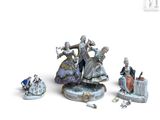 un groupe de figurines assises sur une table