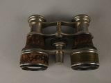 an old pair of binoculars on a table with a white background