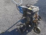 a small machine that is sitting in the gravel