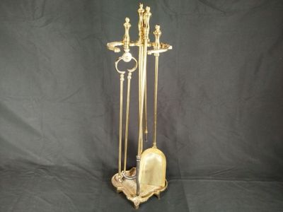 a gold statue of a man and a woman on a stand