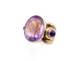 a close up of a ring with an amethorate and amethorate
