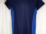 a blue and blue shirt hanging on a white curtain